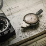 A vintage compass and navigation instrument on an old map, representing an audit and roadmap for growth marketing strategy for startups